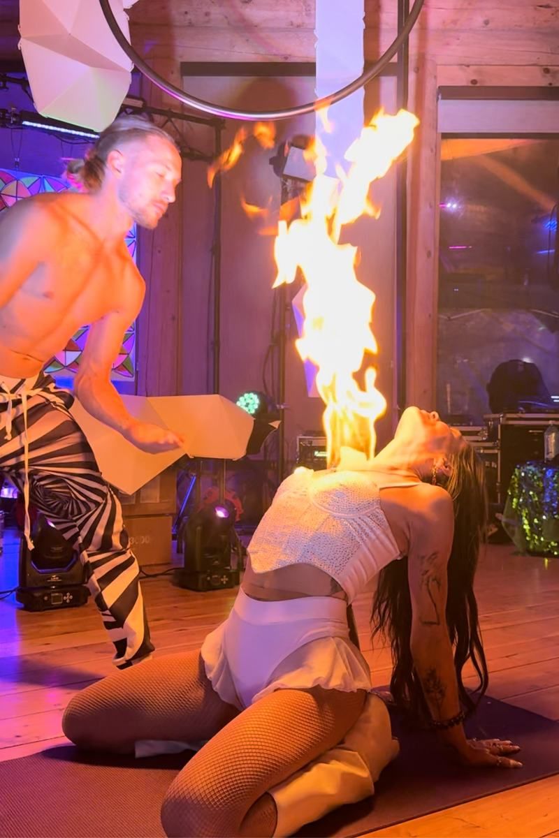 Tyler and a participant holding a sacred fire bubble together